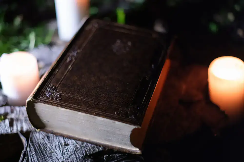 A vintage rulebook resting on a wooden table